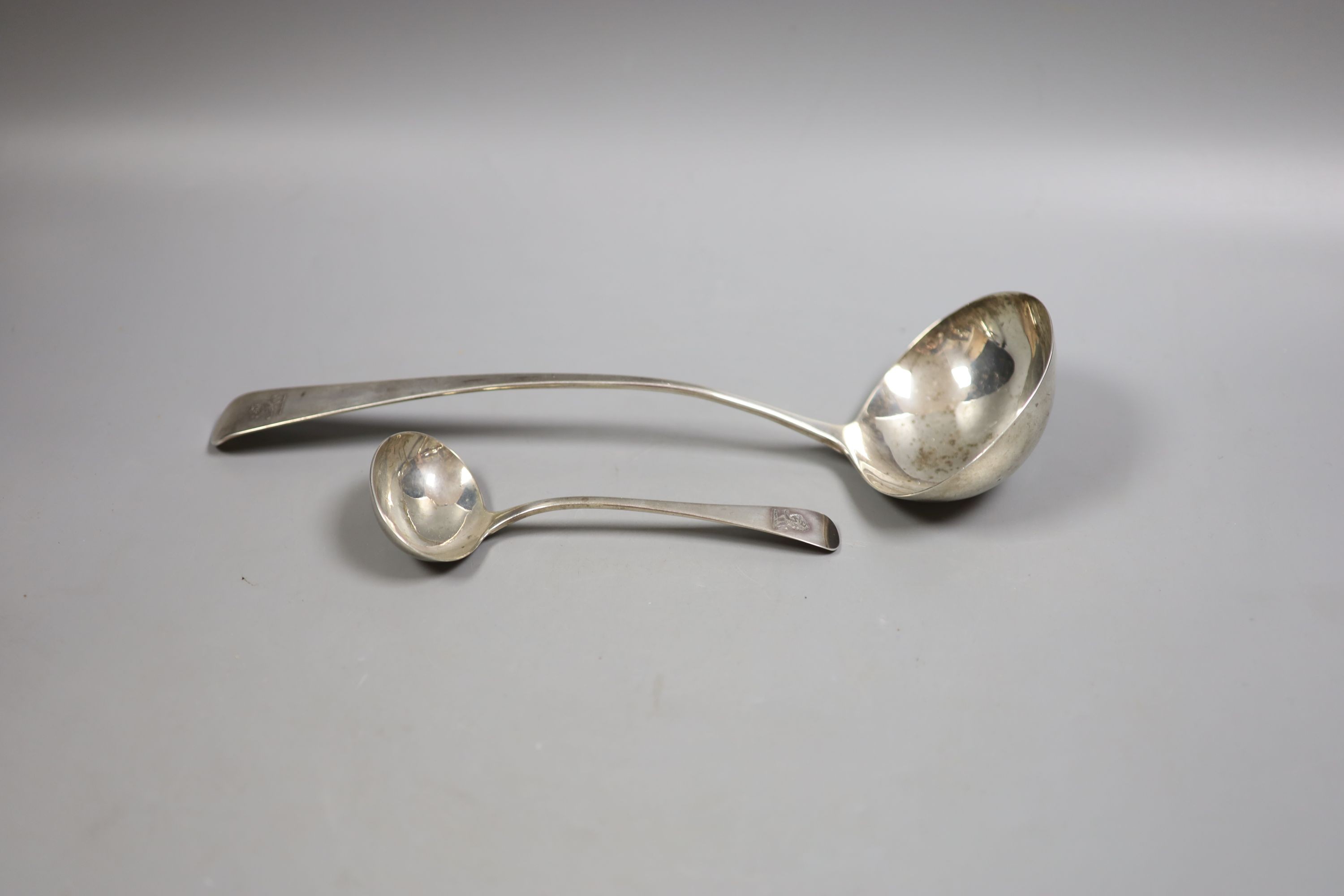 A George III silver Old English pattern soup ladle, London, 1804, 31.1cm and a similar George IV sauce ladle, London, 1824, 196 grams.